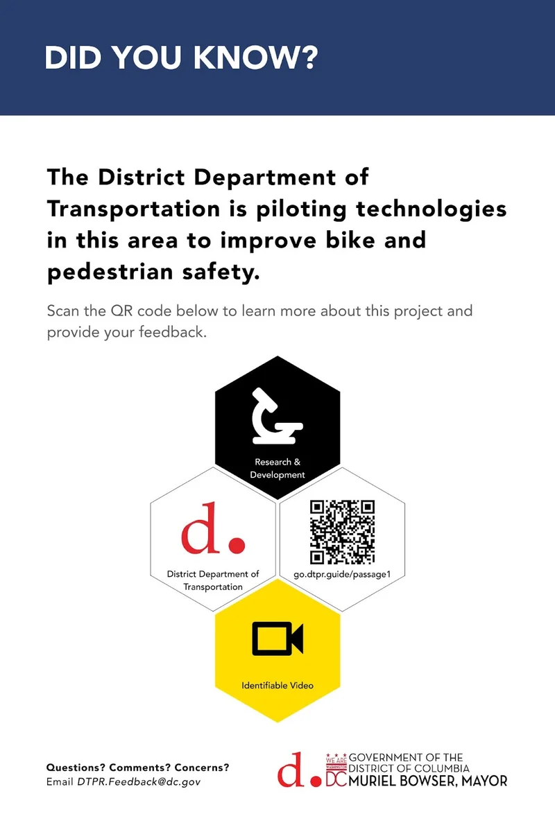 A District Department of Transportation sign about a bike and pedestrian safety pilot, with DTPR icons and a QR code
