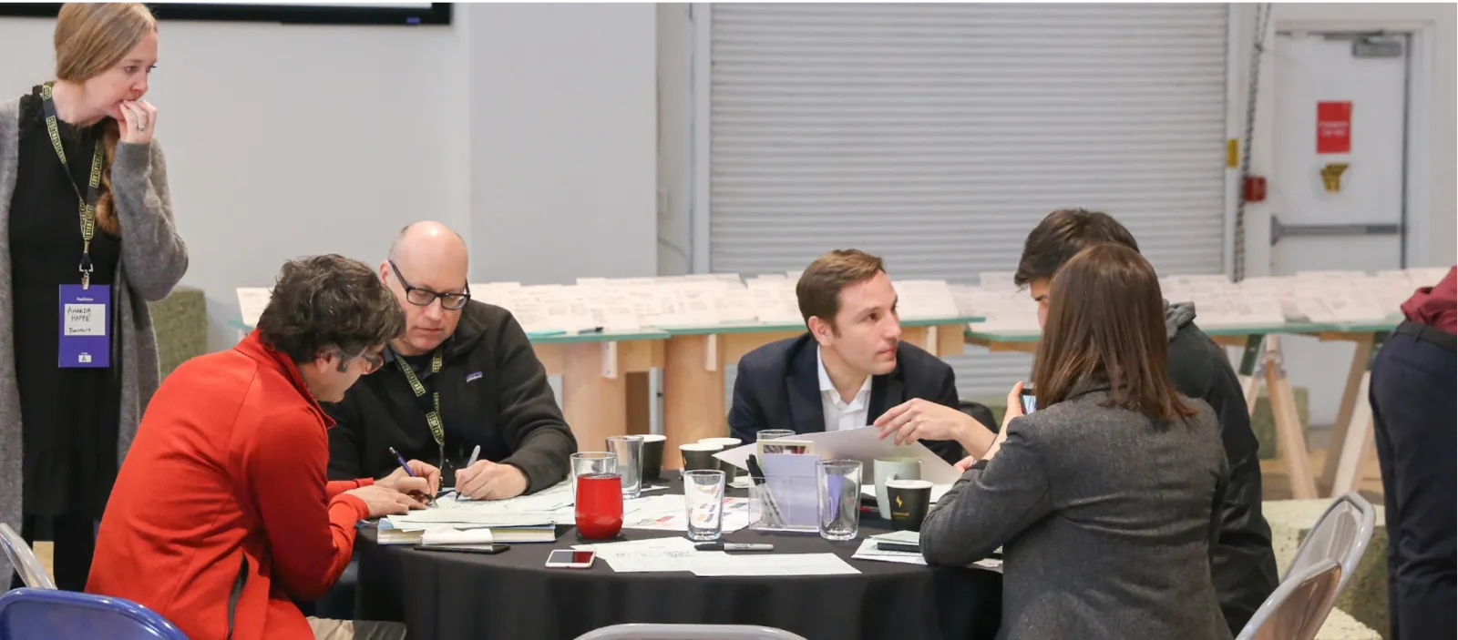 Residents and facilitators around a table at a DTPR co-design workshop